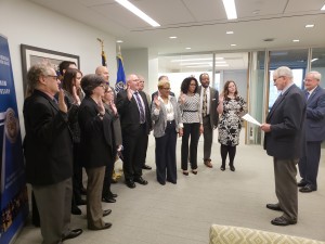 WASHINGTON, DC (March 20, 2018) John Pinto, director of field operations for the Federal Mediation and Conciliation Service (FMCS), administers the oath of office to a group of new federal mediators from around the country at the FMCS headquarters. The mediators were at the headquarters to attend a five-day training program to prepare them for their role in helping to resolve labor-management conflicts, build better relationships, and create more effective organizations. (FMCS Photo/Greg Raelson)