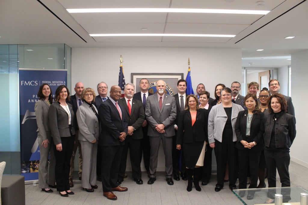 WASHINGTON, DC (March 19, 2019) Federal Mediation and Conciliation Service (FMCS) Deputy Director Richard Giacolone (center) poses with newly commissioned federal mediators from around the country at the FMCS headquarters. The mediators were at the headquarters to attend a five-day training program to prepare them for their role in helping to resolve labor-management conflicts, build better relationships, and create more effective organizations. (FMCS Photo/Heather Brown)