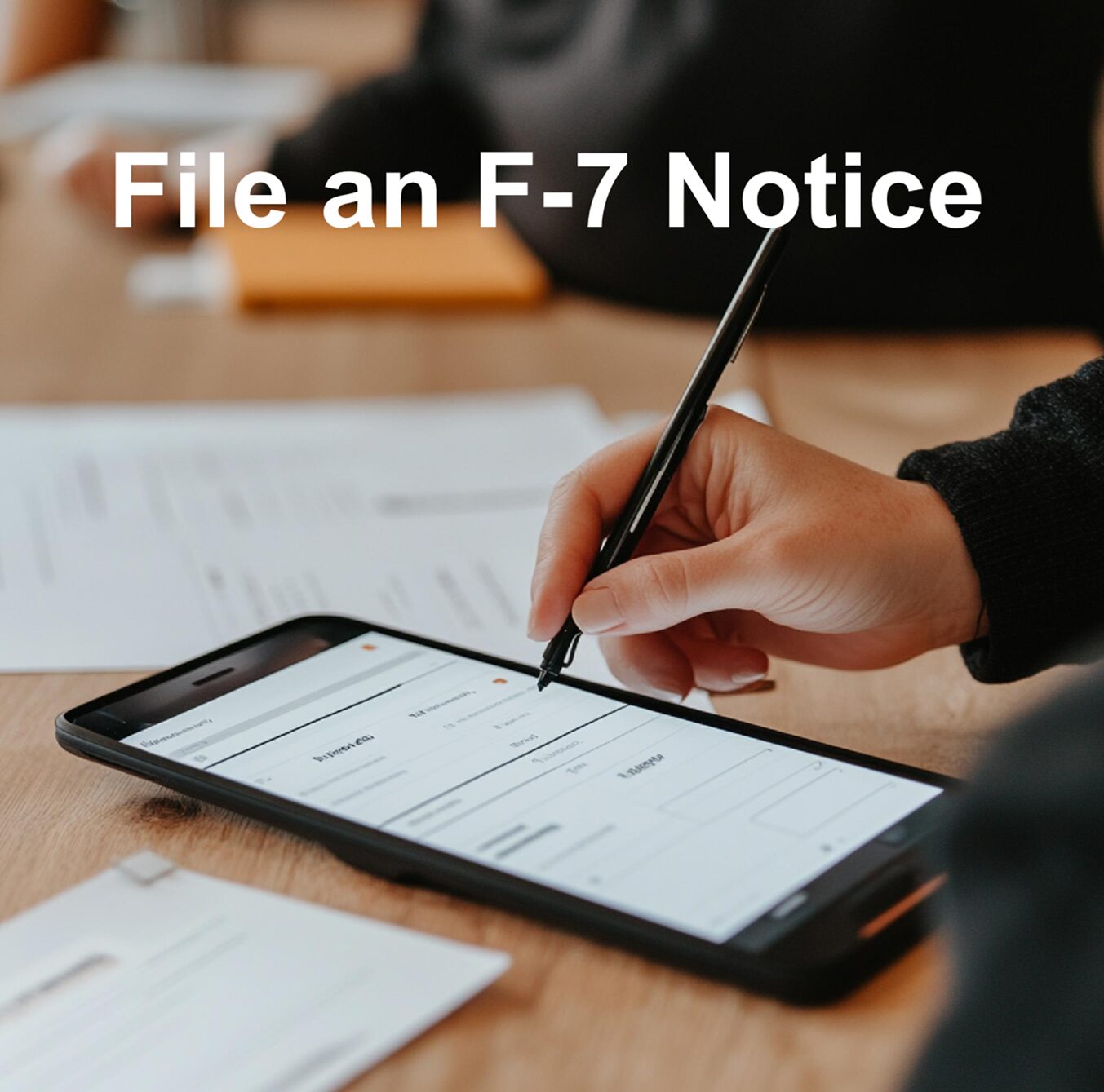 f7 notice hand using a stylus to complete a form on an electronic tablet
