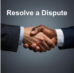 Two hands in a handshake exending from business suits