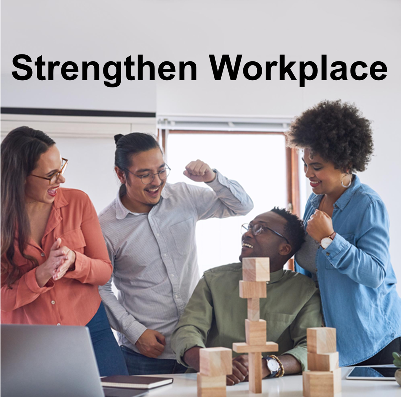 strengthen workplace 2 multicultural workers solving a block puzzle at a table